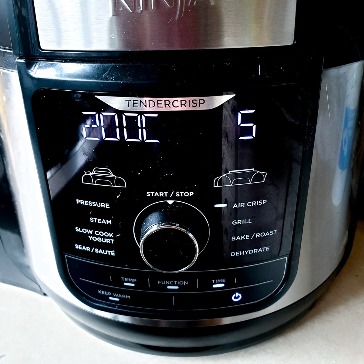 A Ninja multi-cooker showing the settings for preheating.