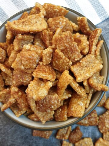 Overhead shot of a dish of crispy pork scratchings.