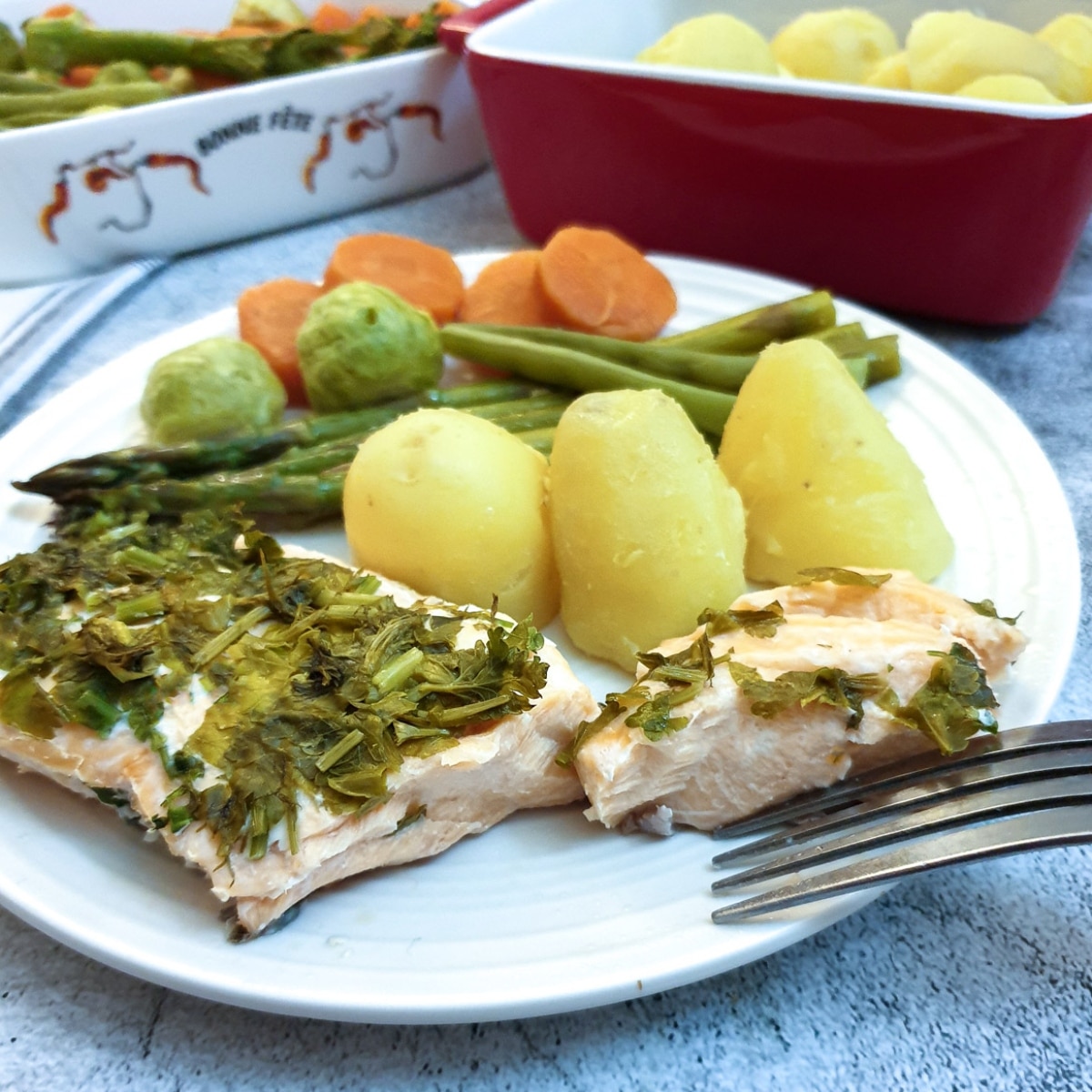 Herb butter salmon and asparagus parcels with lemon Foodle Club