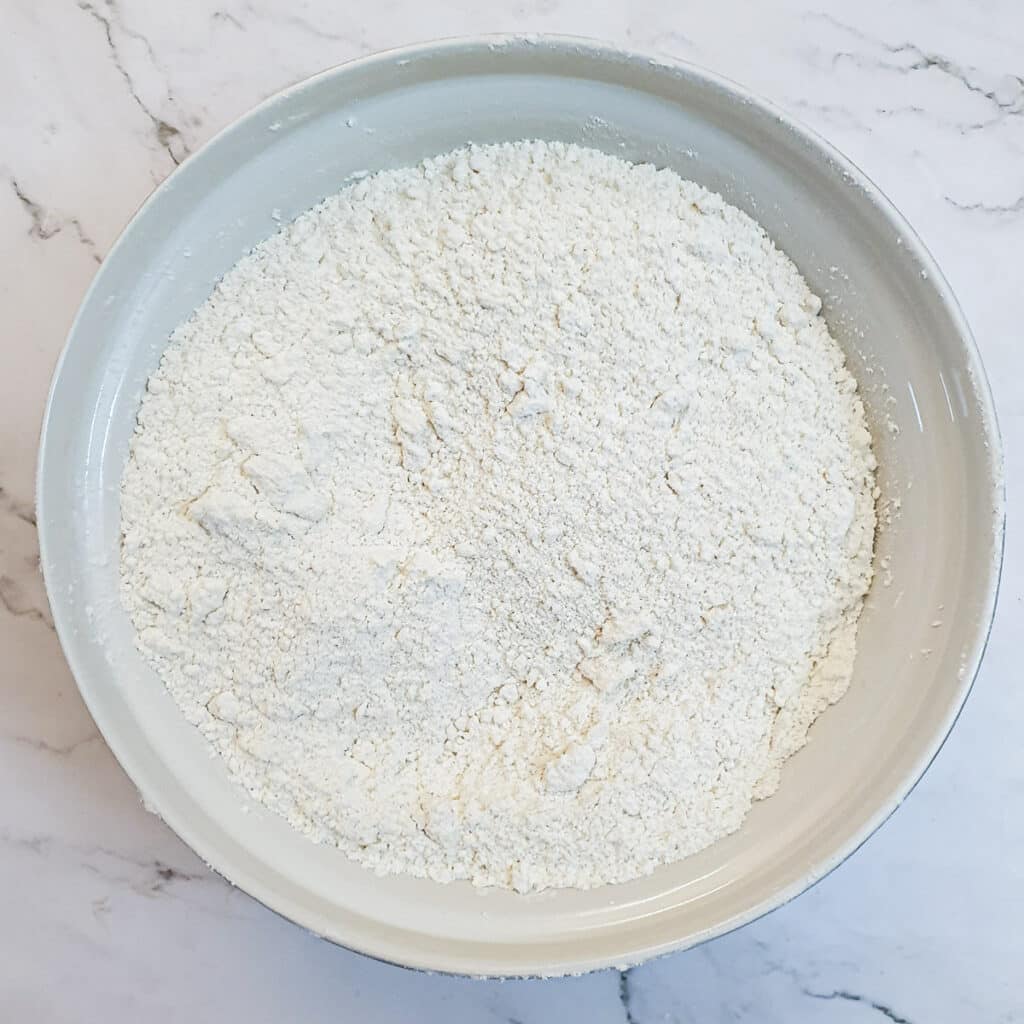 Butter rubbed into flour to form 'breadcrumbs'.