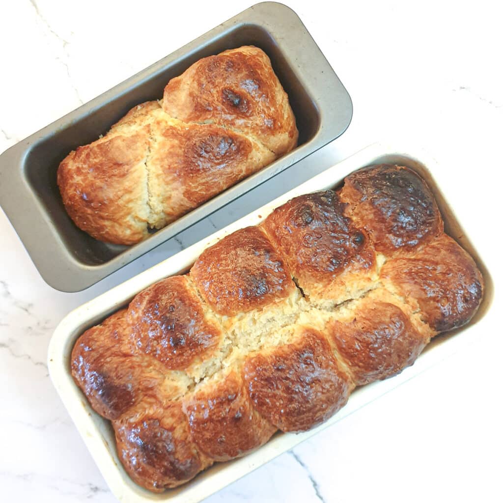 Two baking tins of fully baked buttermilk rusks.