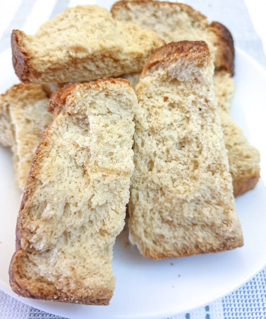 A pile of buttermilk rusks on a white plate.