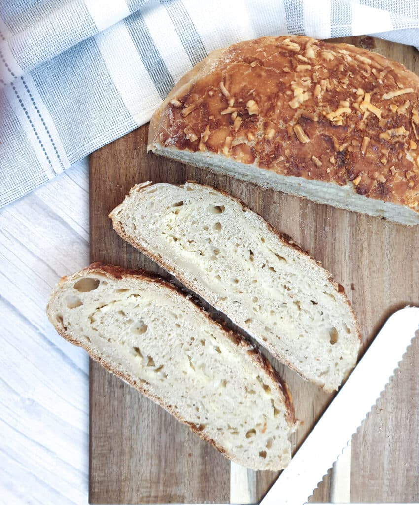 Two slices of cheese and onion bread showing the cheese and onion laminations.