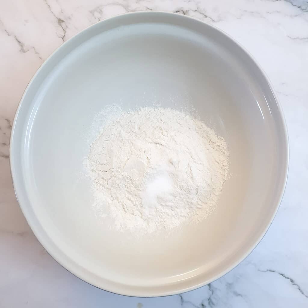 Flour and salt in a large mixing bowl.