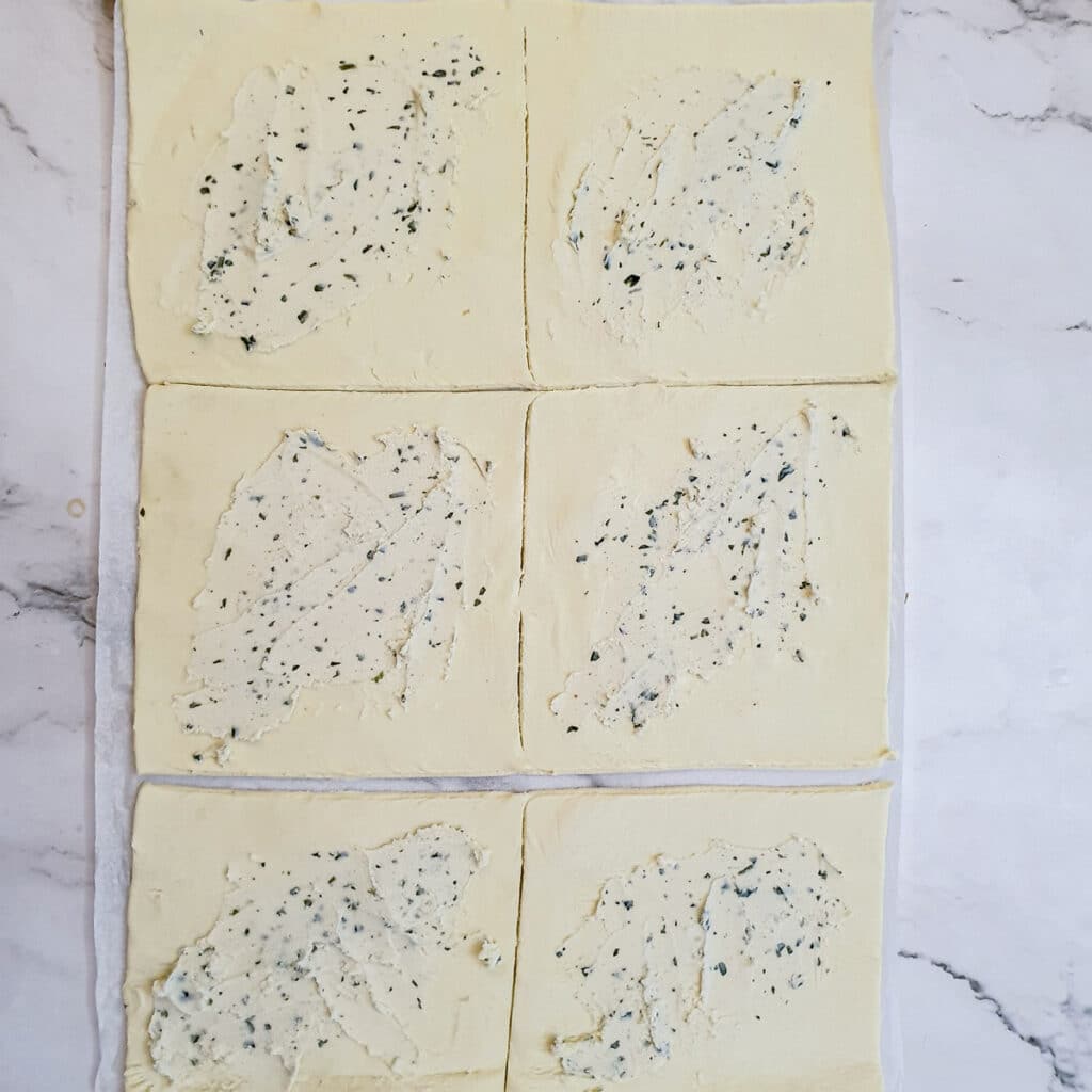 6 squares of puff pastry spread with garlic and herb flavoured cream cheese.