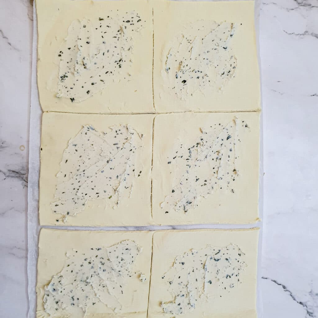 6 squares of puff pastry spread with garlic and herb flavoured cream cheese.