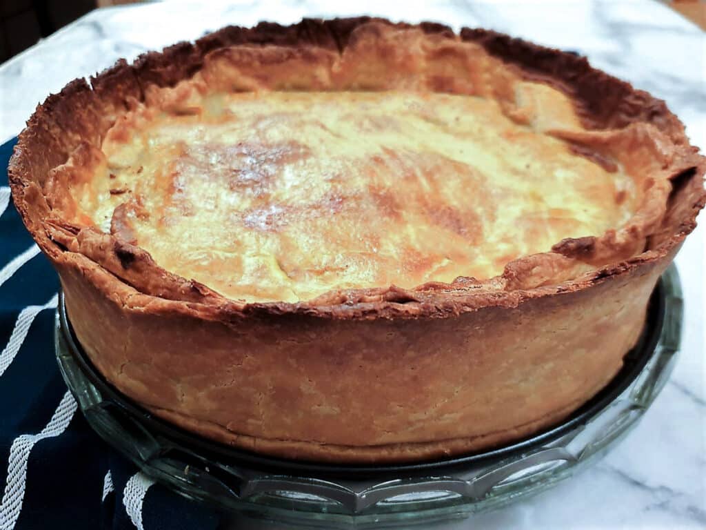 A raised beef and onion pie fresh from the oven.