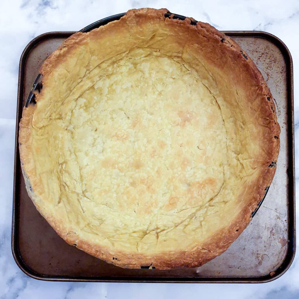 A fully cooke3d pastry case in a springform pan.