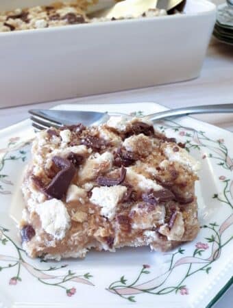 A slice of honeycomb caramel tart on a green-rimmed plate.