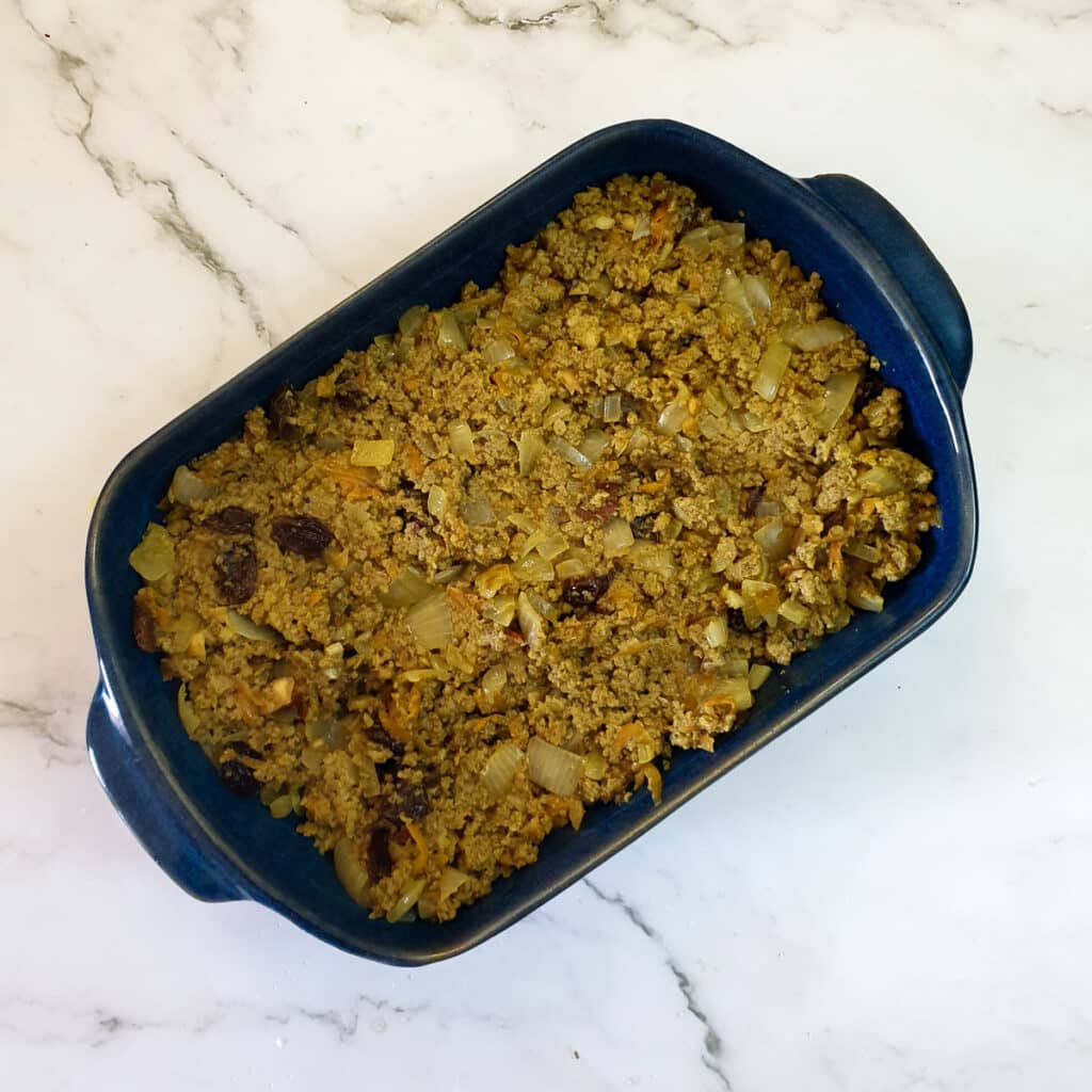 Bobotie mince in a baking dish.