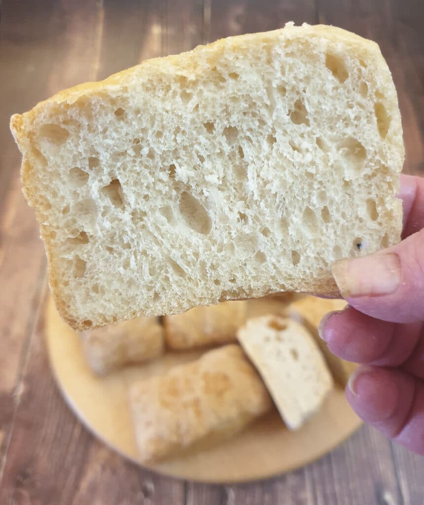 Close up of the inside of a ciabatta roll.