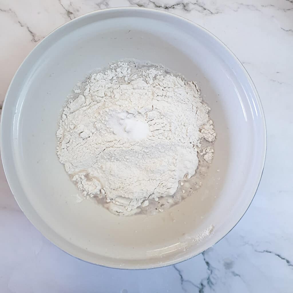 Flour added to yeast and water.