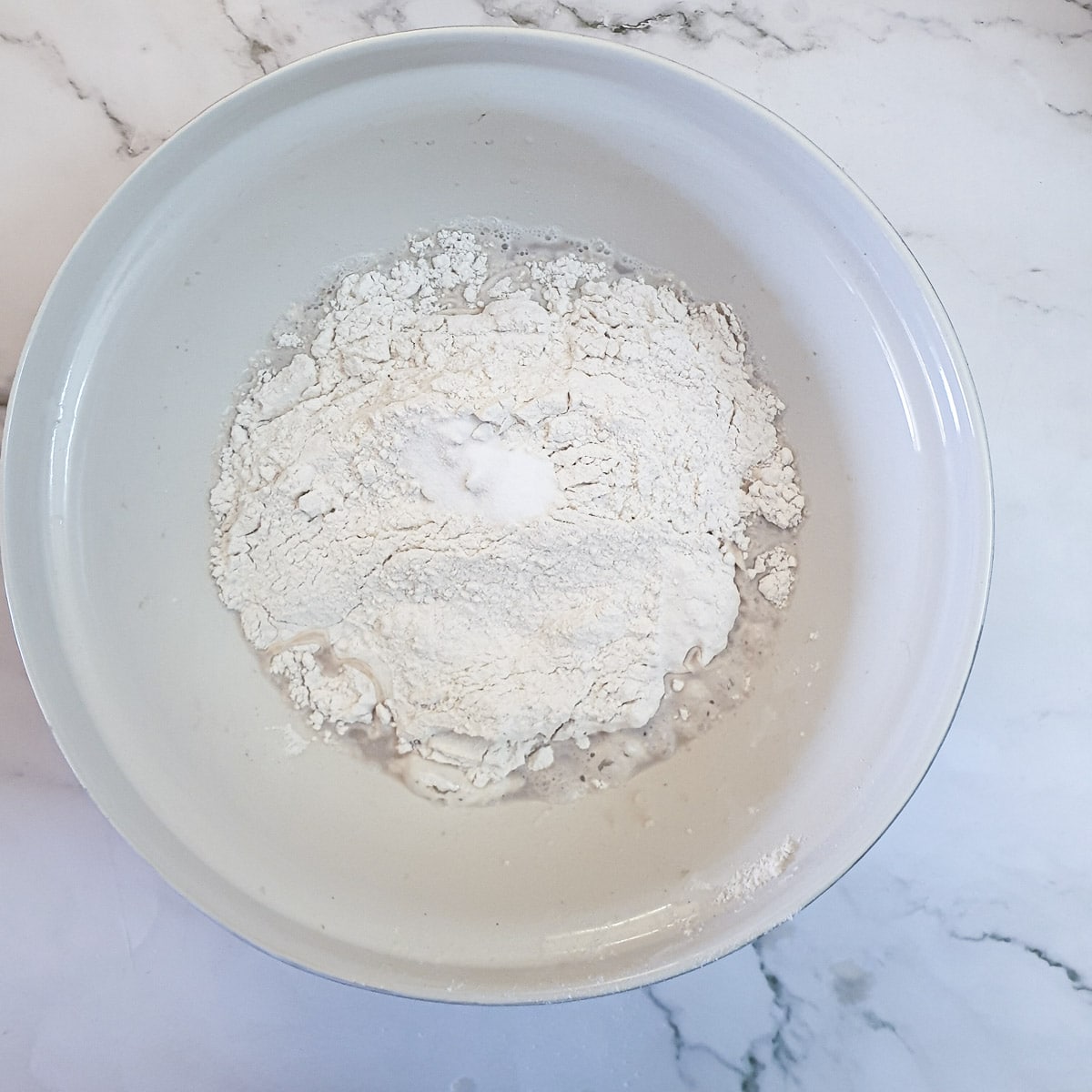 Flour added to yeast and water.