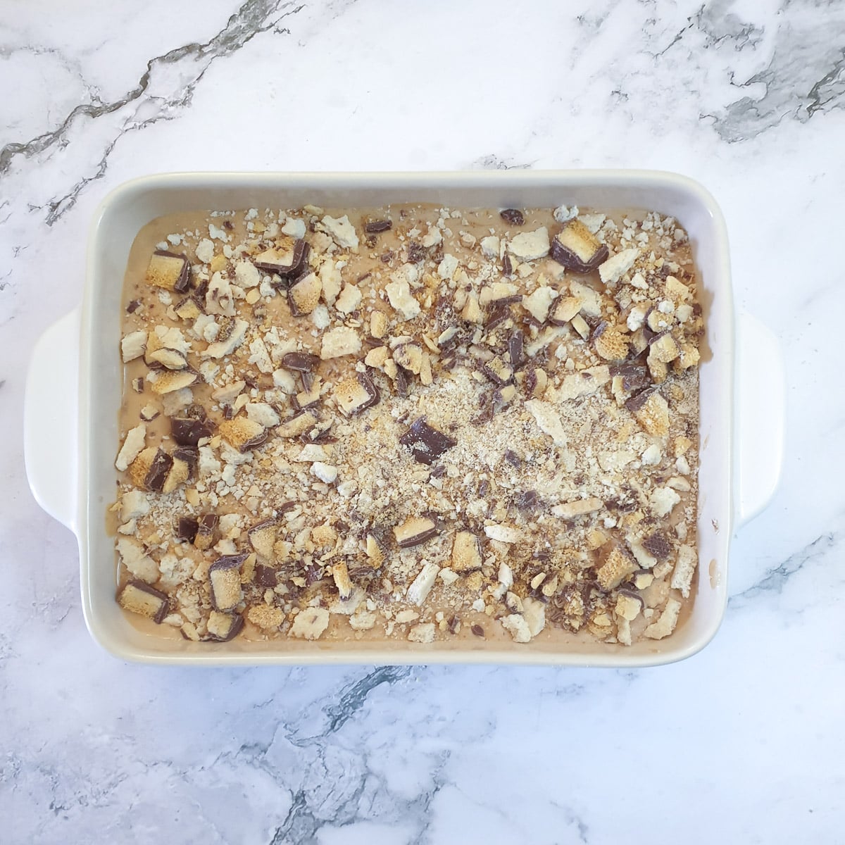 A complete honeycomb caramel tart in a baking dish.