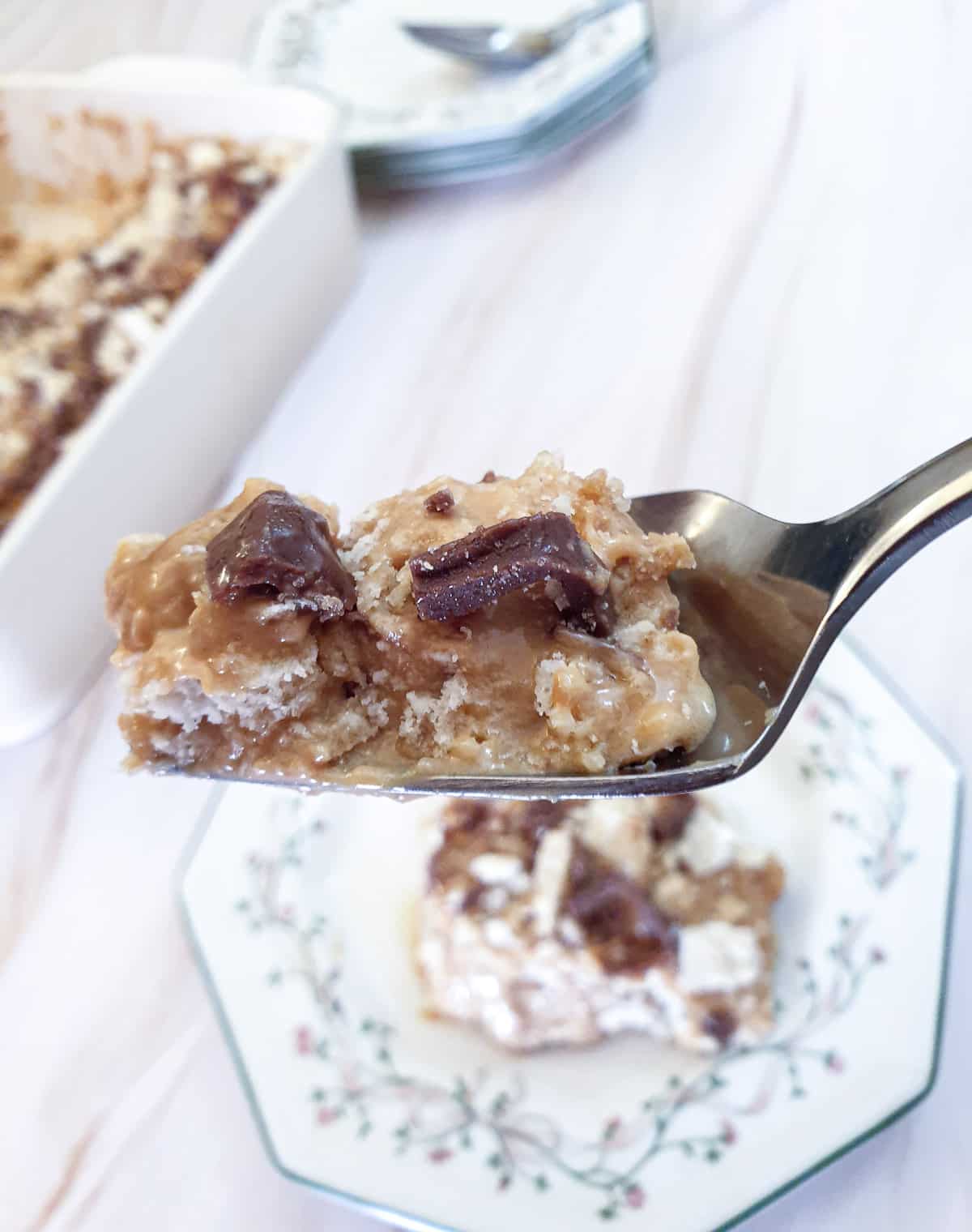 A fork holding a mouthful of honeycomb caramel tart.