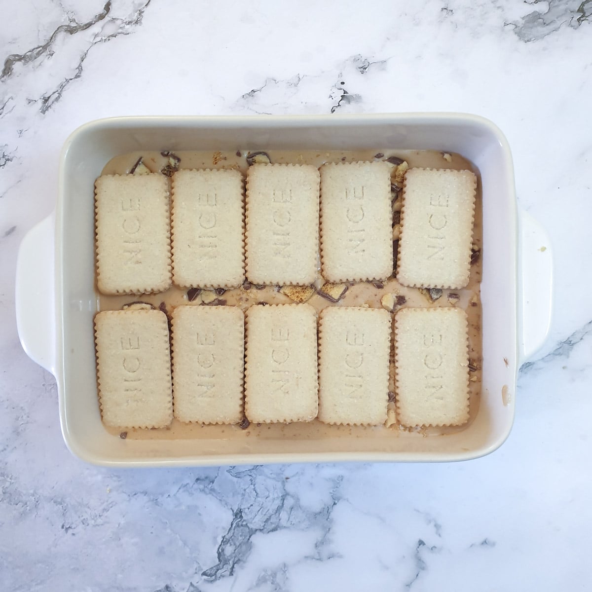 A second layer of biscuits added to the honeycomb caramel tart.