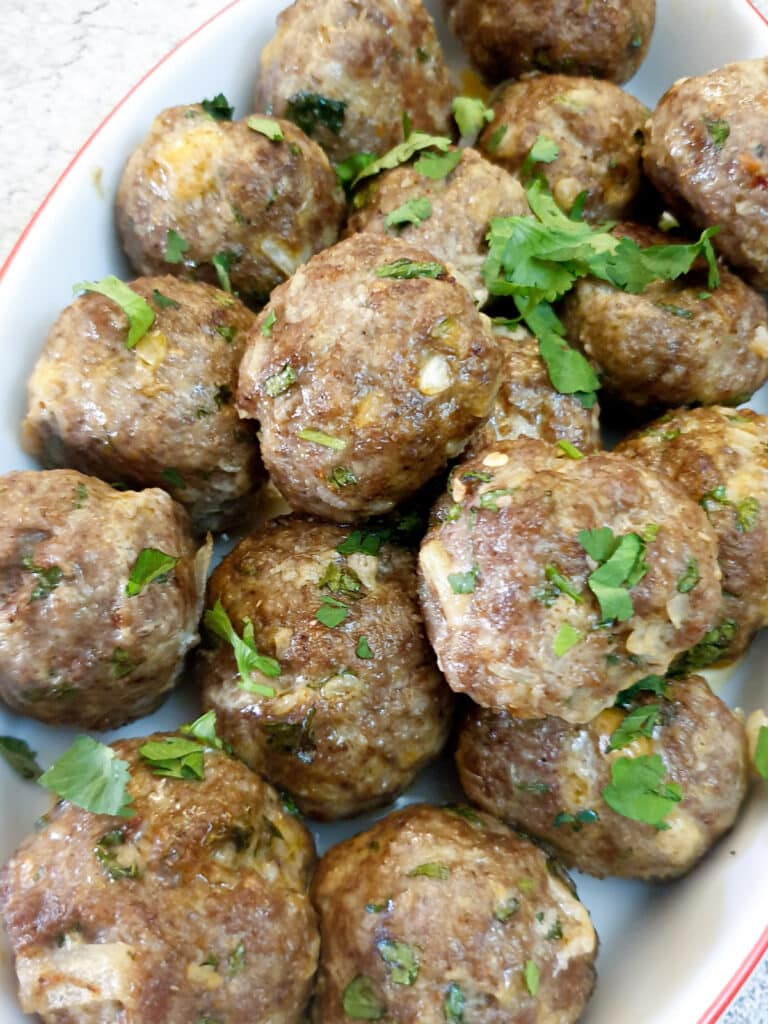 Closeup of a dish of Moroccan lamb meatballs.
