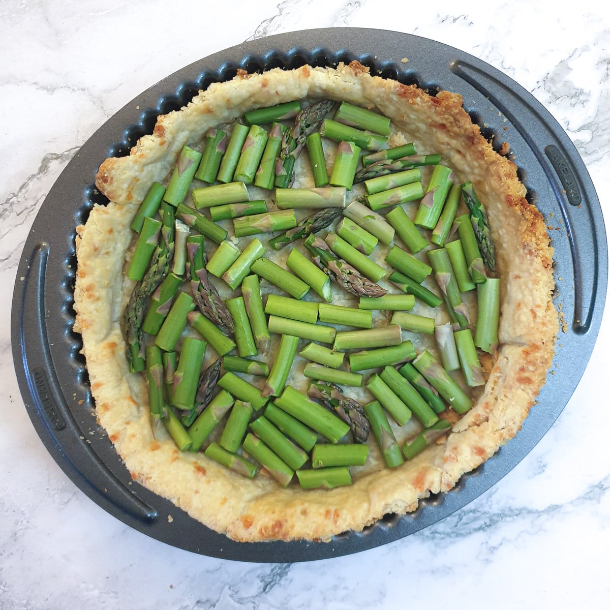 Chopped asparagus in a pastry shell.