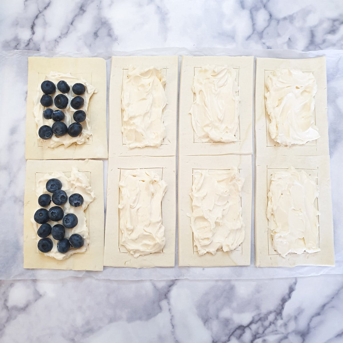 8 rectangles of puff pastry spread with mascarpone cheese.