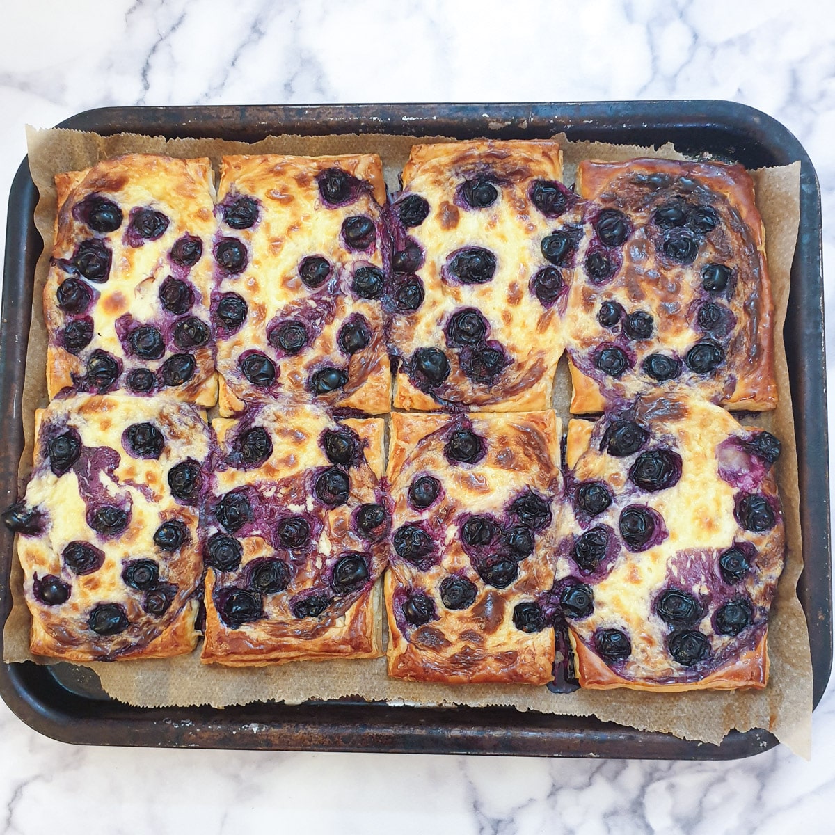 8 baked blueberry cream cheese Danish pastries.