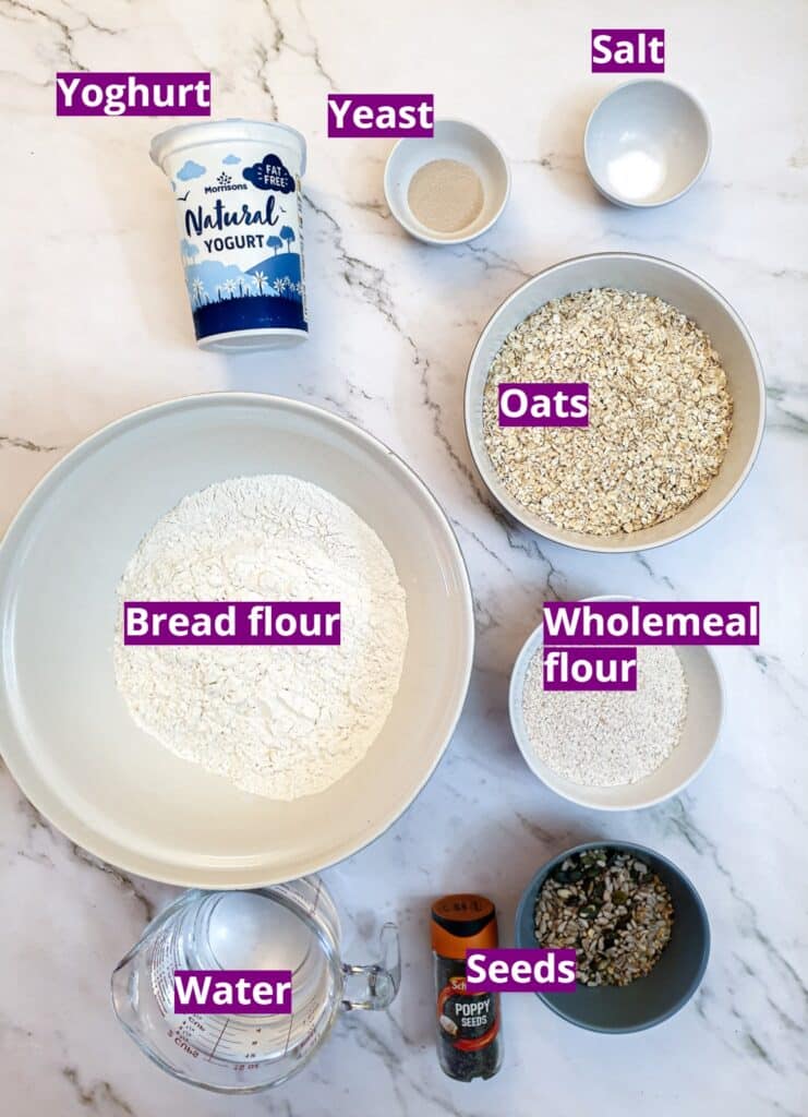 Ingredients for making no-knead seeded bread rolls.