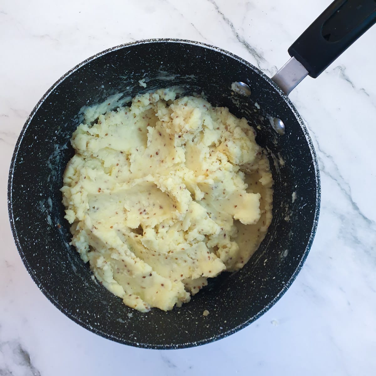 Mashed potatoes in a saucepan.