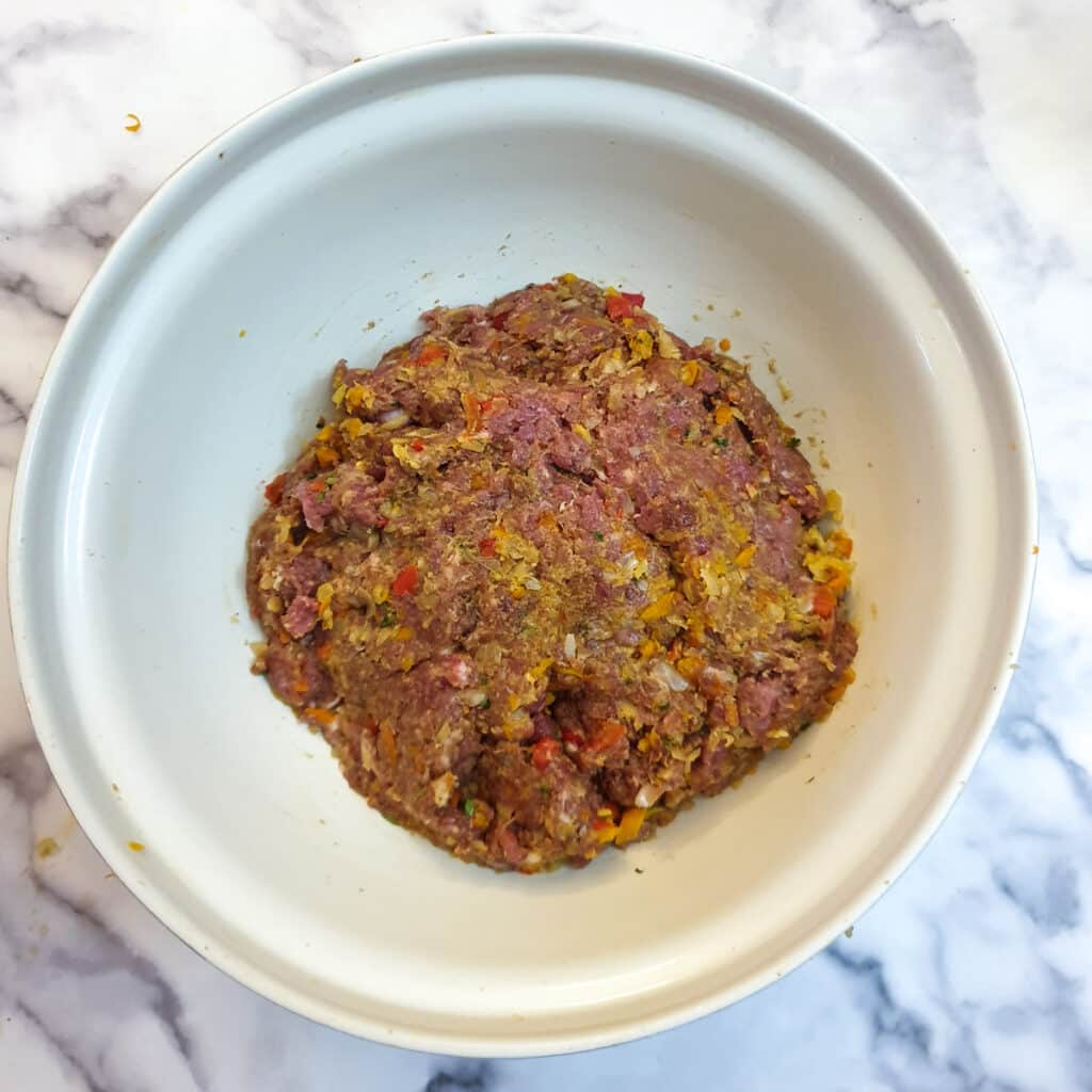 Lamb kofta mixture in a large mixing bowl.