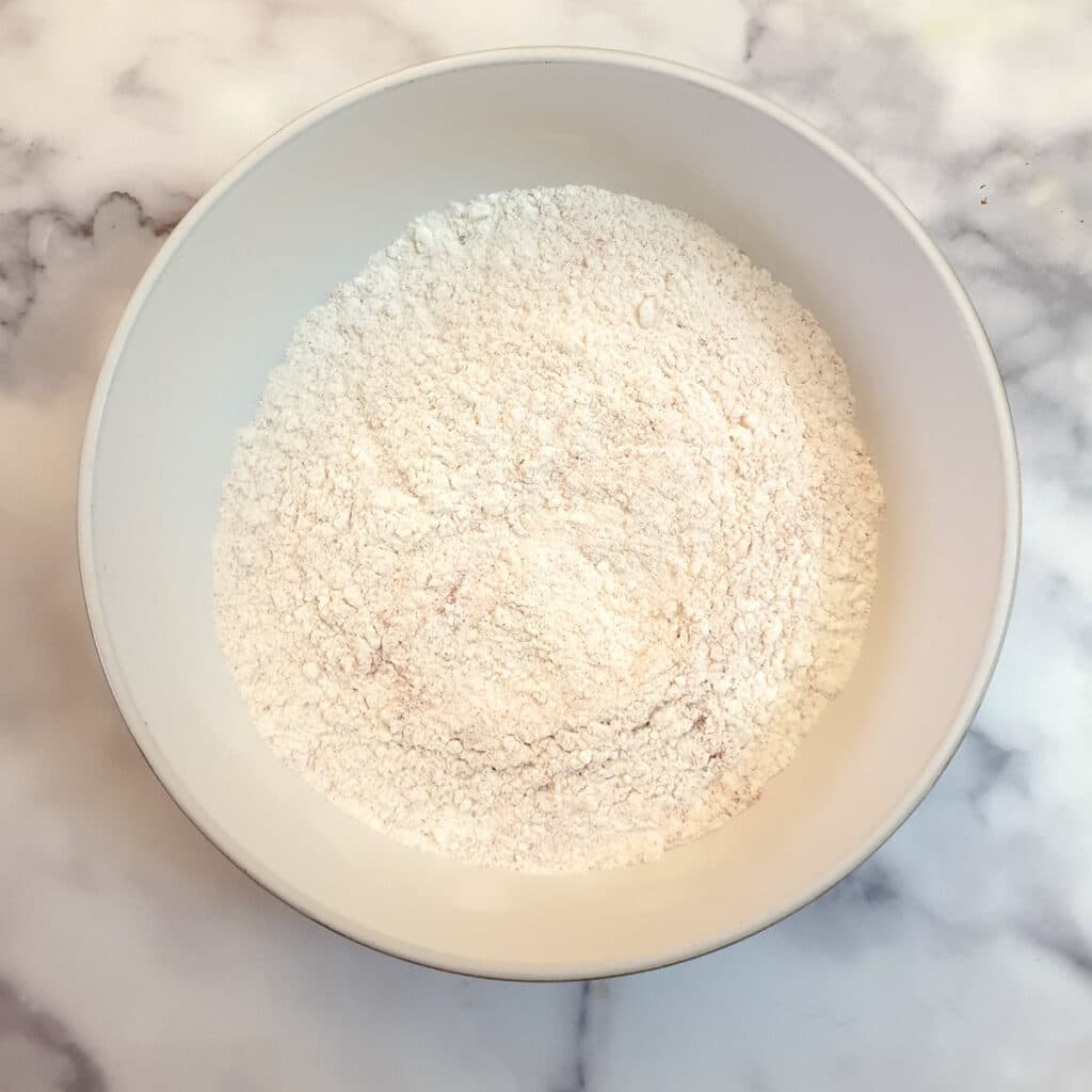 Flour in a white dish.