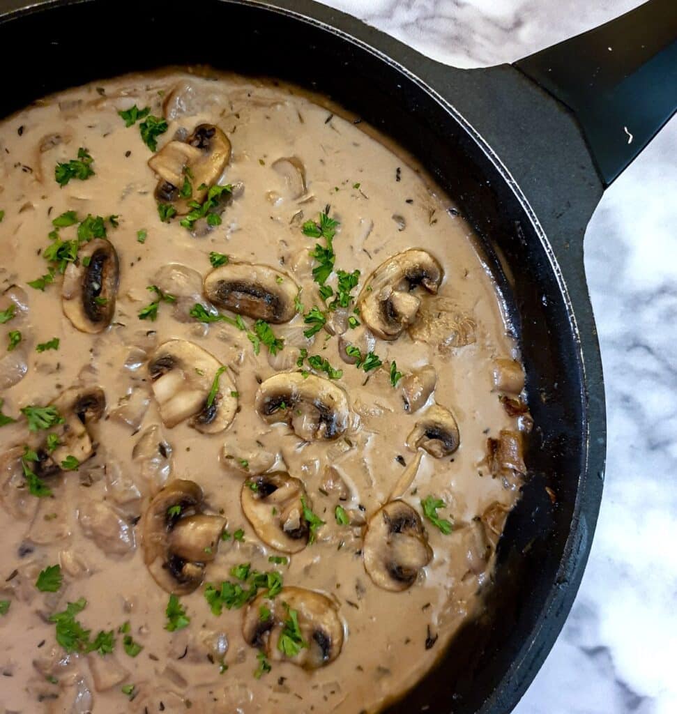 Close up of marsala mushroom sauce in a frying pan.