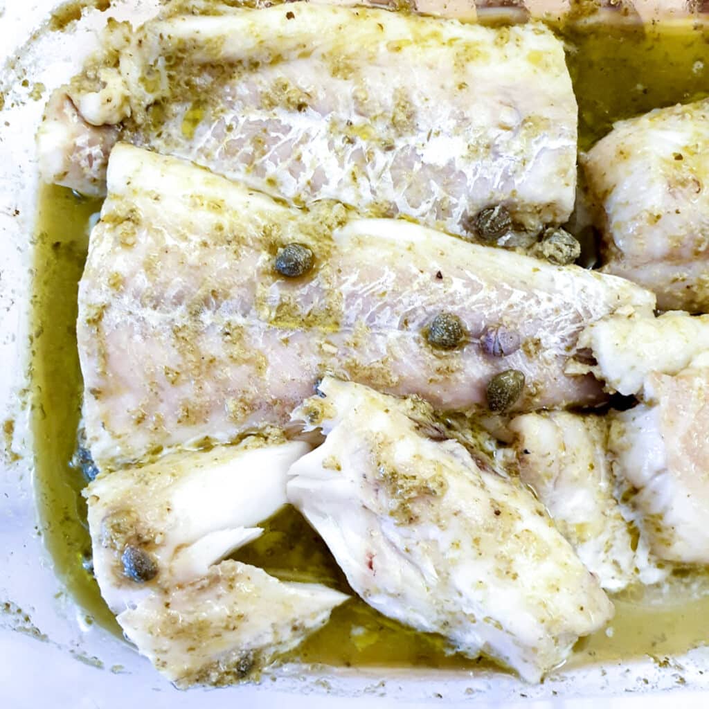 Close up of baked cod, showing how the cooked cod can be flaked.