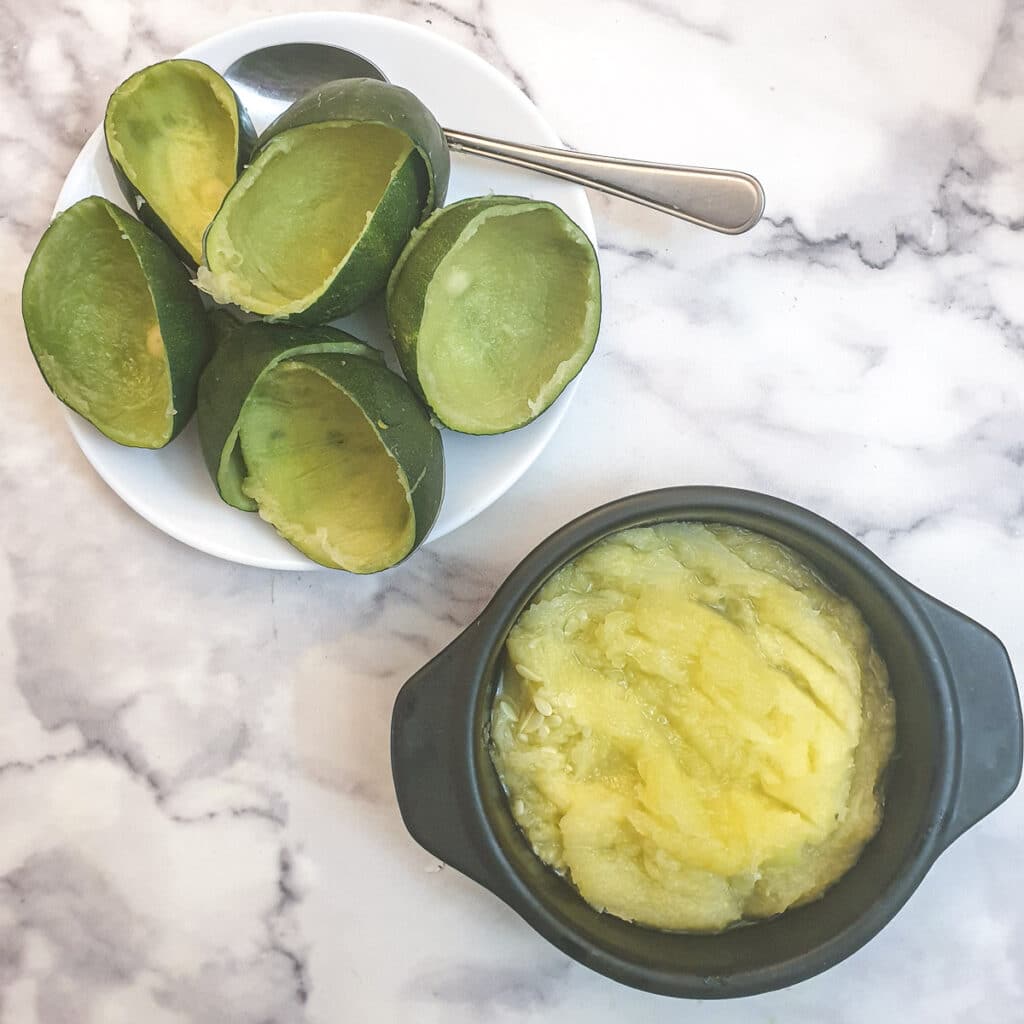 Cooked gem squash flesh removed from the outer skin and placed in a bowl.