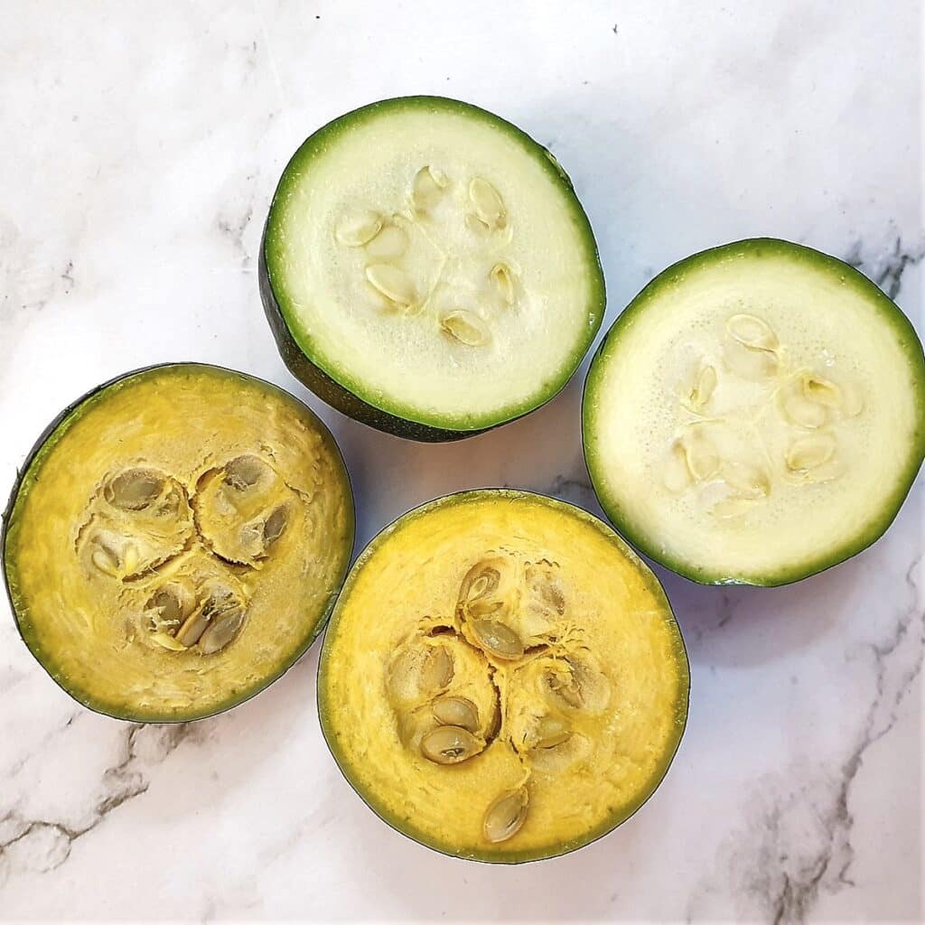 4 halved gem squash - 2 pale green and 2 darker yellow.