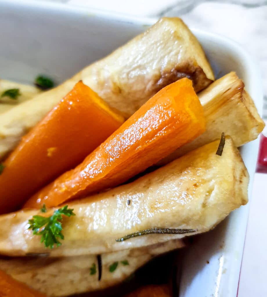 Closeup of honey-roasted carrots and parsnips.