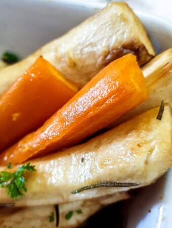 Closeup of honey-roasted carrots and parsnips.