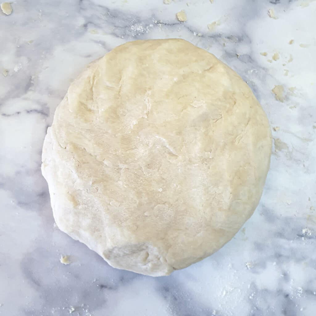 A ball of dough ready to be rested in the refrigerator.