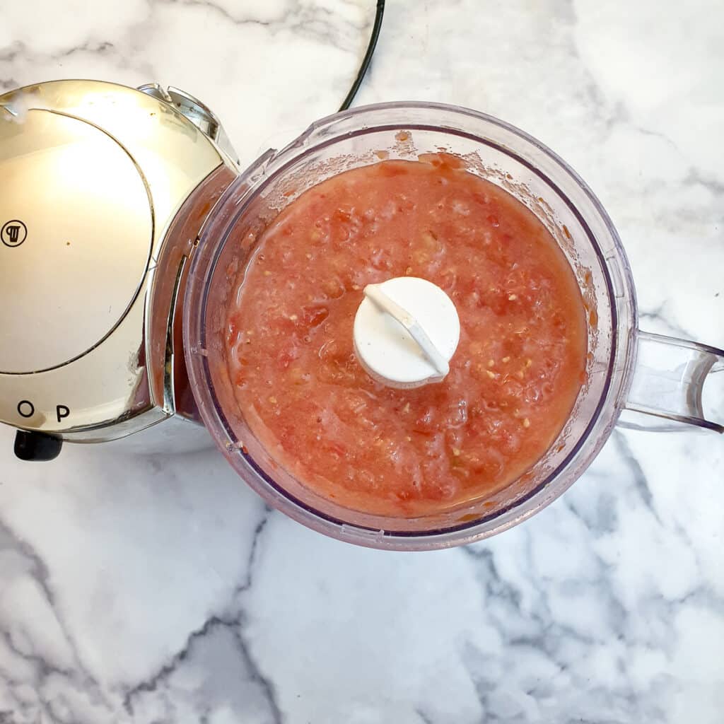 Pulped tomatoes in a food processor.