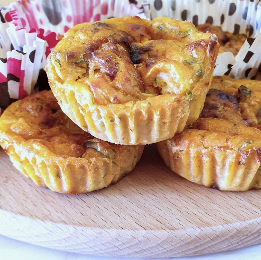 Close up of 3 courgette and tomato puffs.