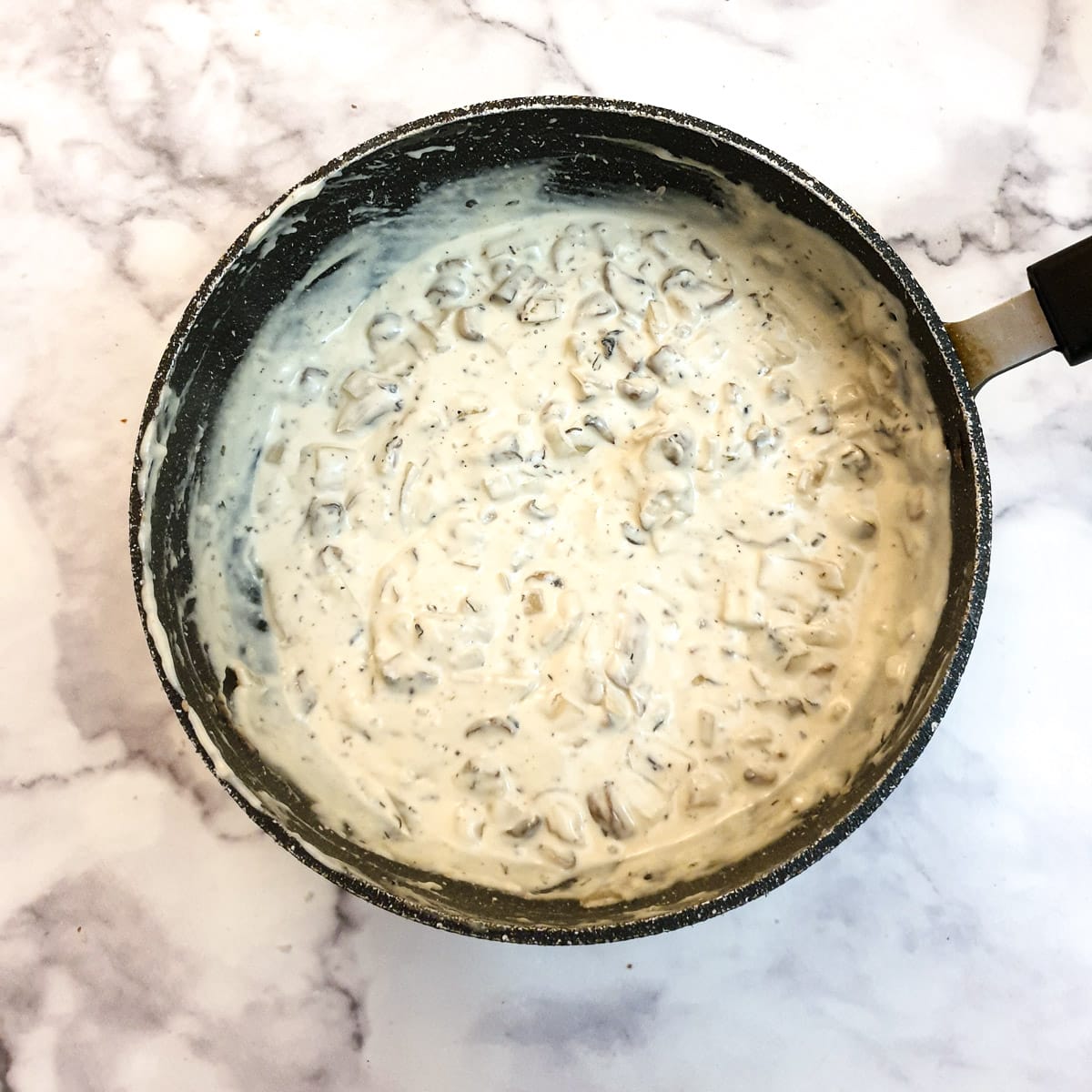 Thickened mushrooms and onions in a cream sauce.