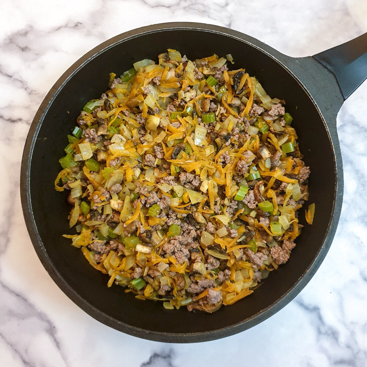 Browned minced beef mixed into carrots, onions and celery.