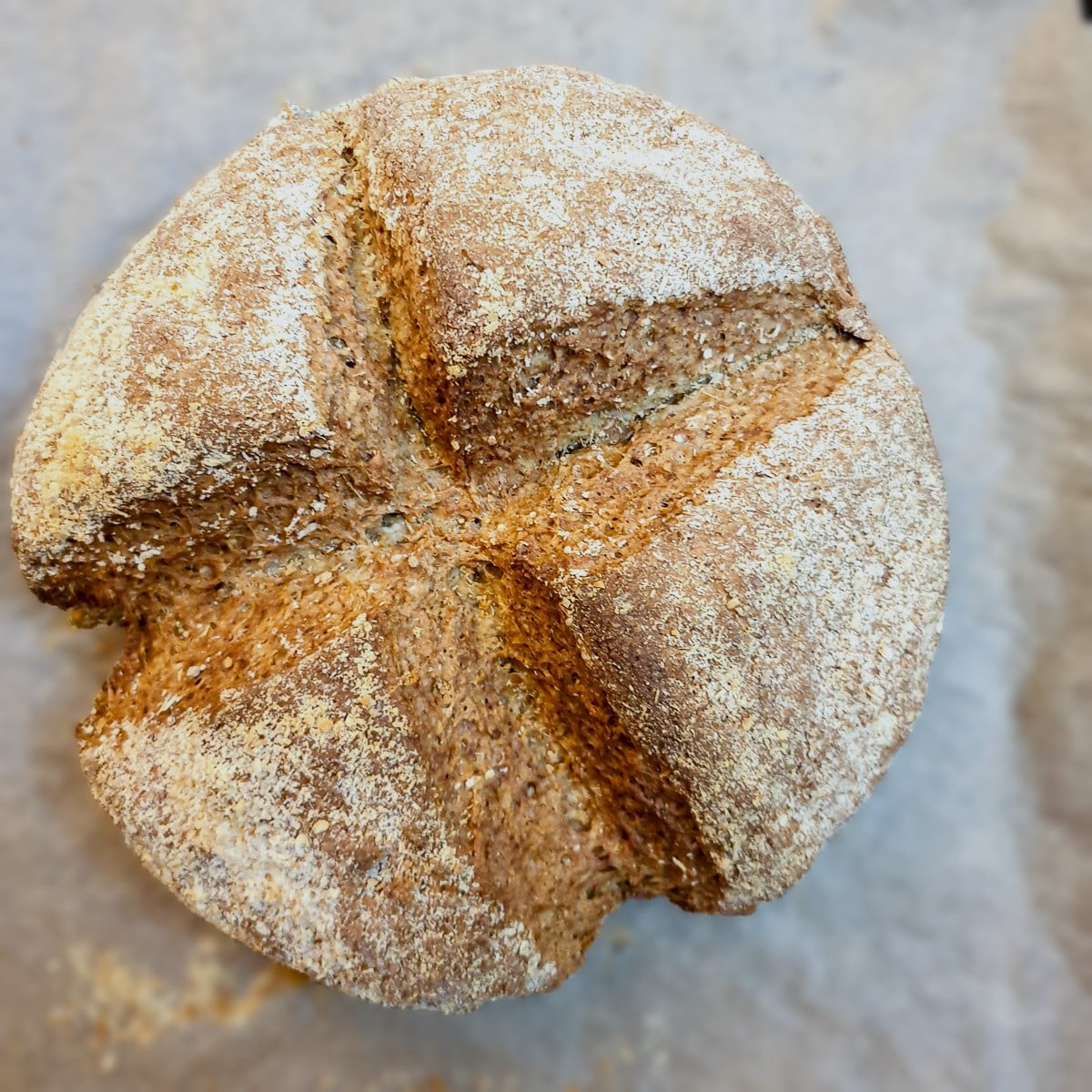 A baked loaf of cheesy wholemeal soda bread.