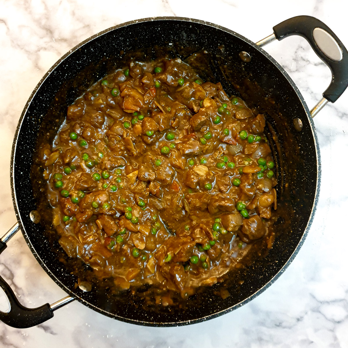 Moroccan lamb pie filling ready to be assembled in the pie.