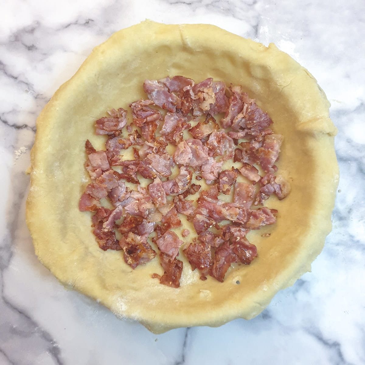 Bacon in a pastry-lined dish.