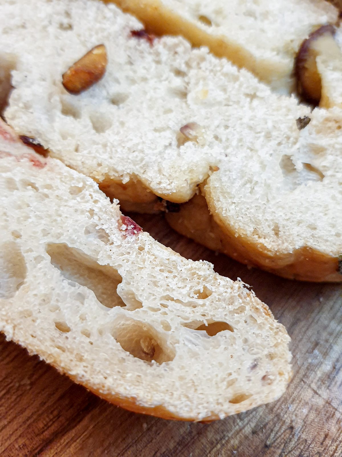 Close up of slices of chestnut and cranberry focaccia bread.