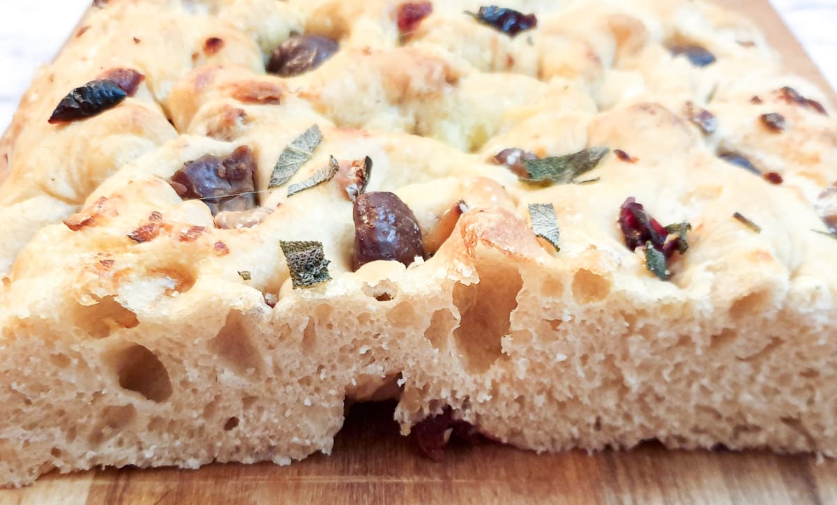 Close up of a cross-section of a focaccia bread showing the texture.