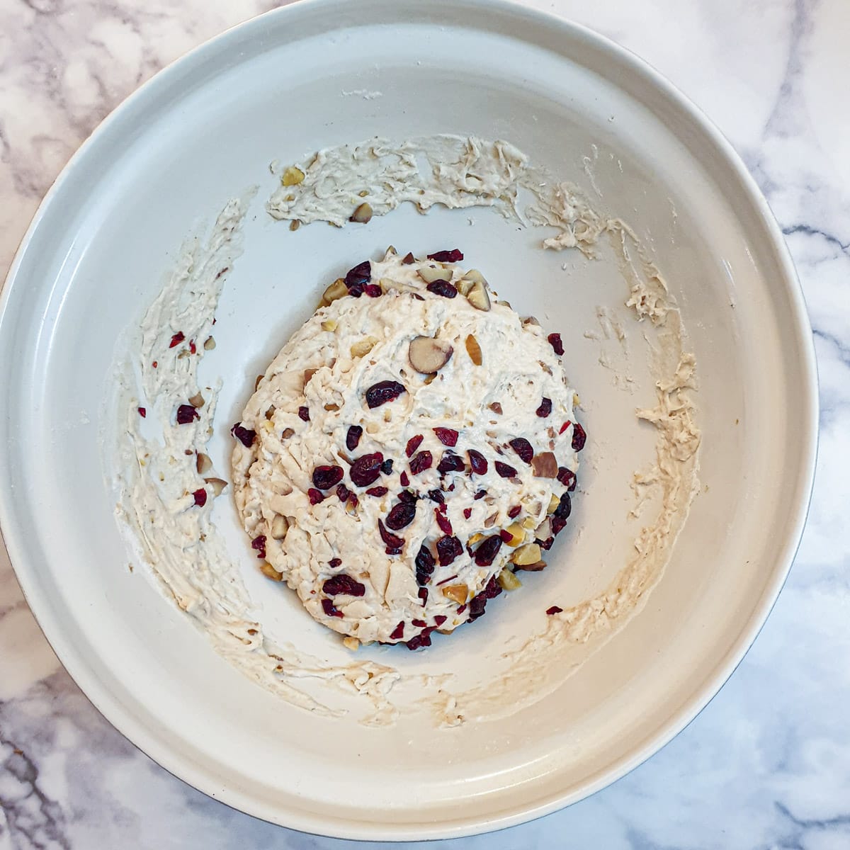 Chopped cranberries and chestnuts mixed with focaccia dough.