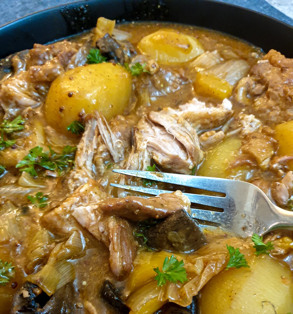 Shredded pork pieces in a dish of pork casserole.