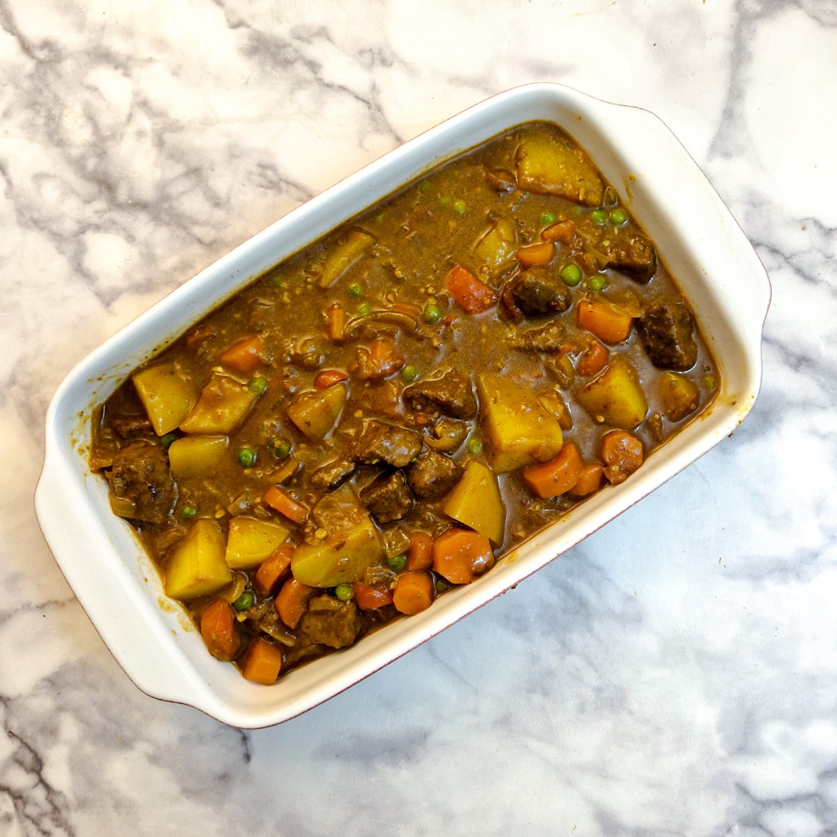 Beef curry filling in a casserole dish.