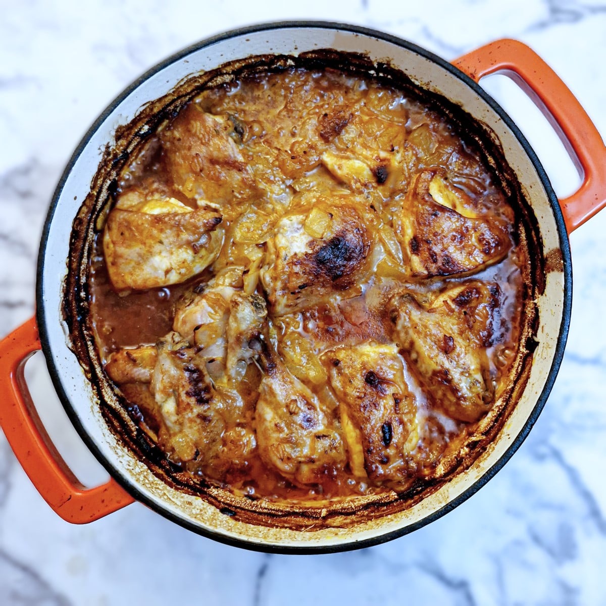 Browned chutney and mayonnaise chicken in a casserole dish.