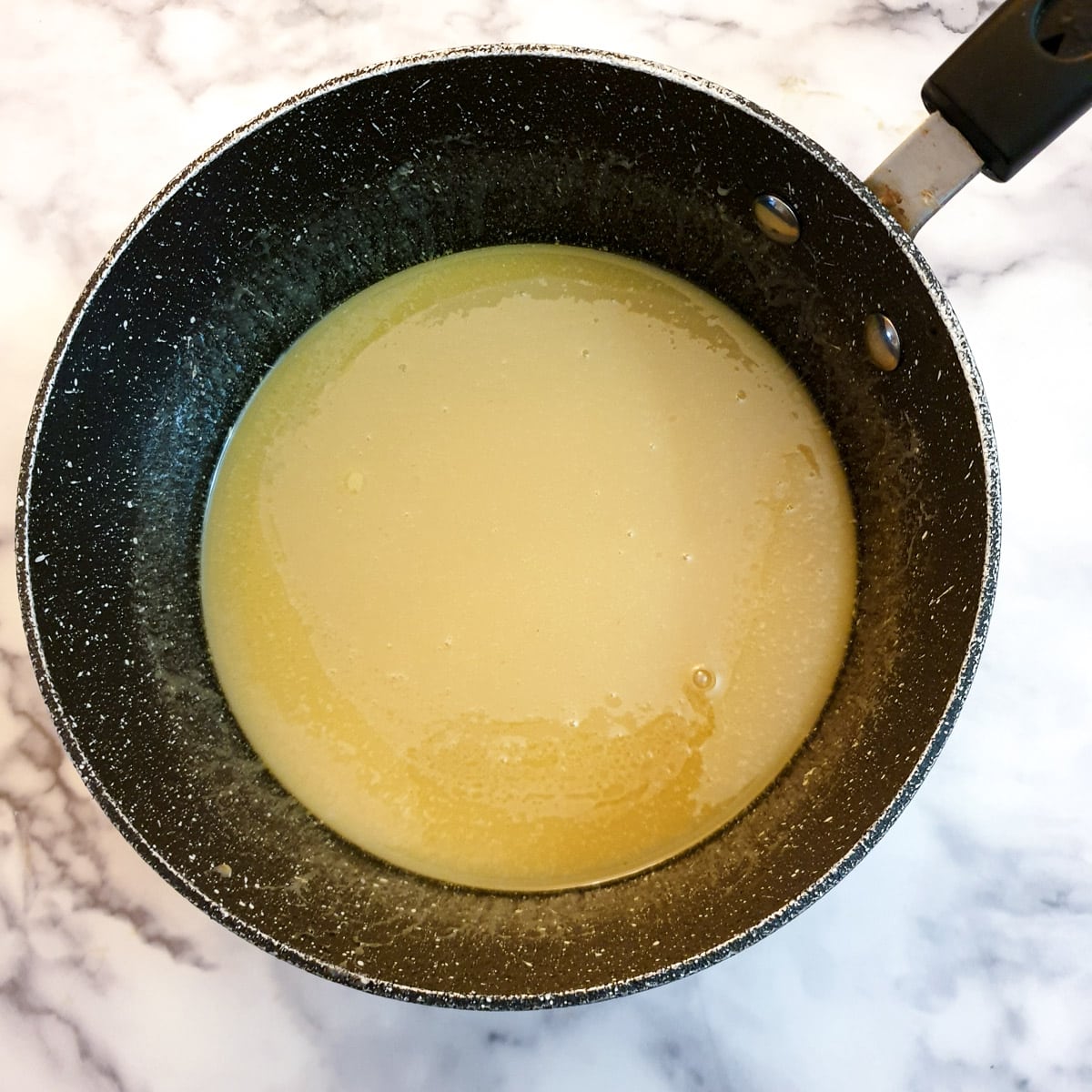 Melted butter, sugar, condensed milk and syrup in a small saucepan.