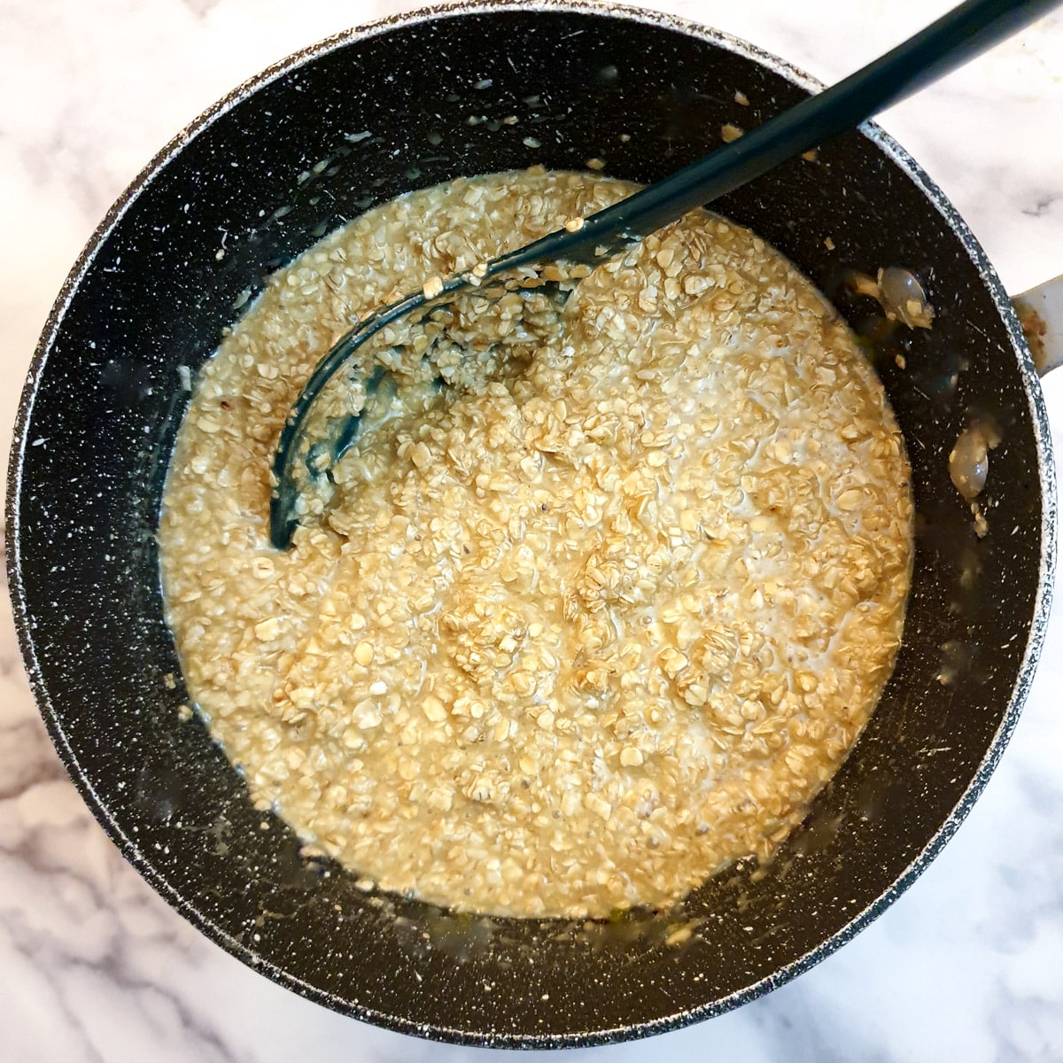 Coconut and oats stirred into the butter mixture.